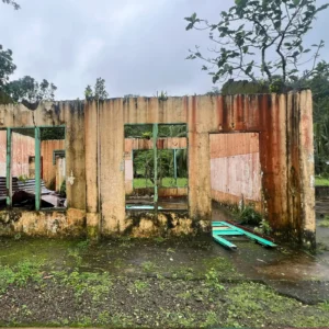 Damaged walls of school classroom with no roof, doors or windows