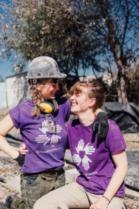 Volunteers Engaging and Smiling to each other on the Worksite