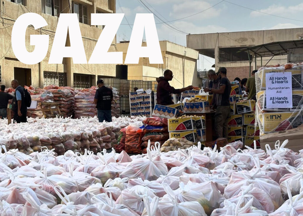All Hands & Hearts staff pack produce for distribution in Gaza