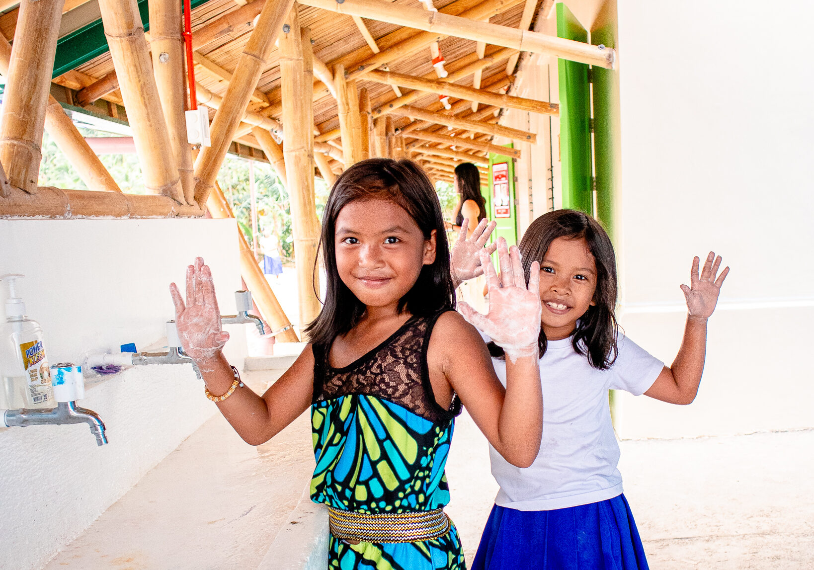 Students practicing good sanitation with their new sinks, complemented with filtered water from their new systems.