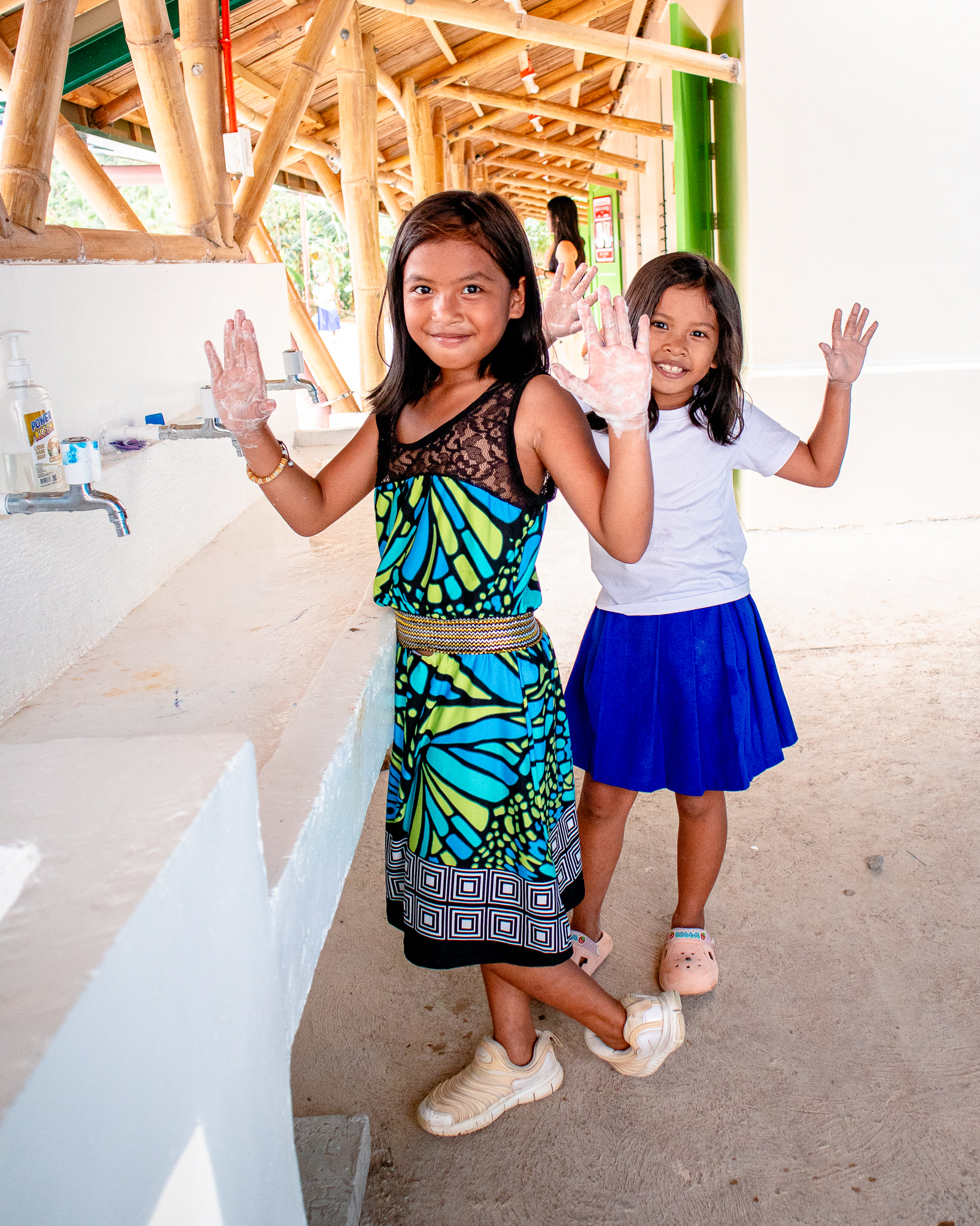 Students practicing good sanitation with their new sinks, complemented with filtered water from their new systems.